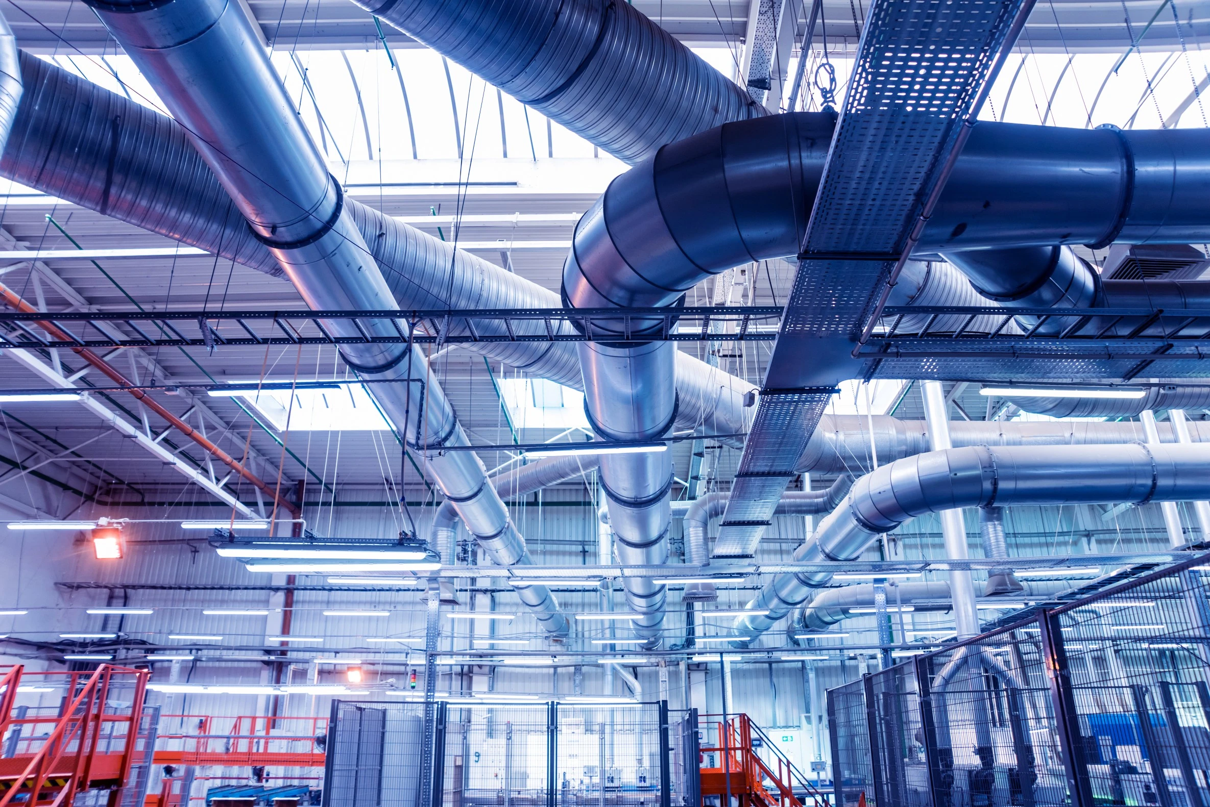 Industrial HVAC ductwork and piping in a manufacturing facility