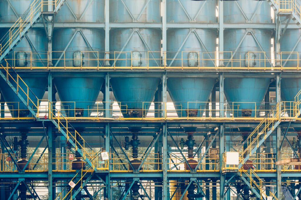 A complex industrial plant with extensive pipework and steelwork
