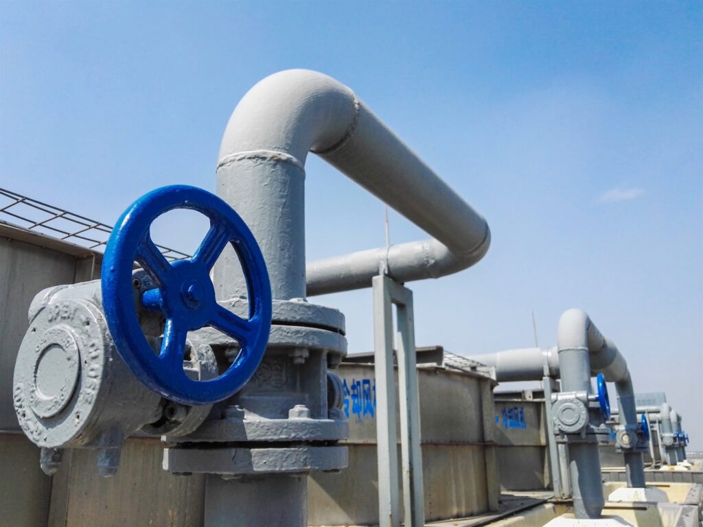 A central chilled-water cooling plant with large machine pipework and valves