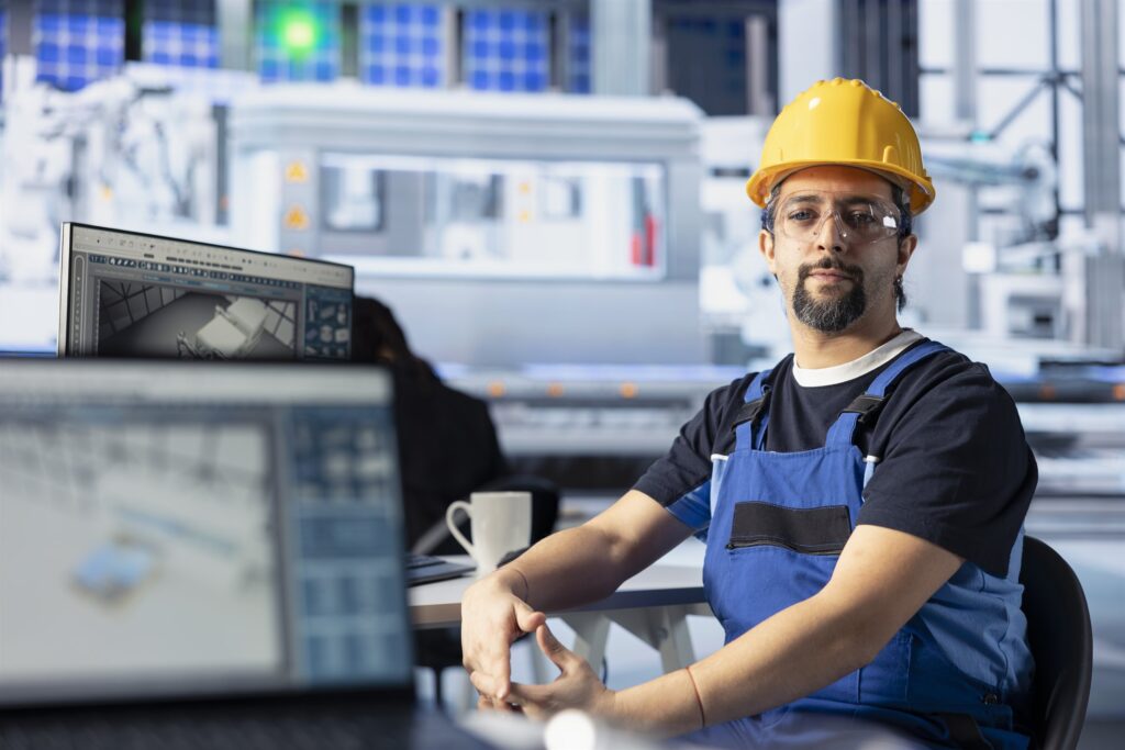 Engineer analysing energy system performance data at an industrial facility