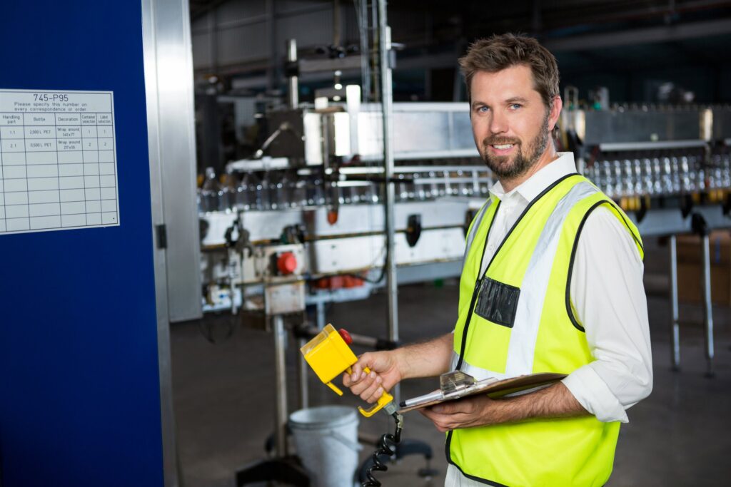 EM3 engineer working with machinery on the plant floor