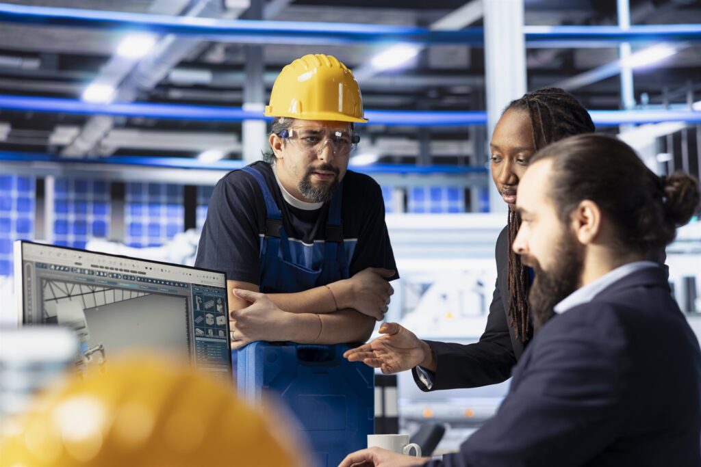 An engineering team reviewing system performance at a facility