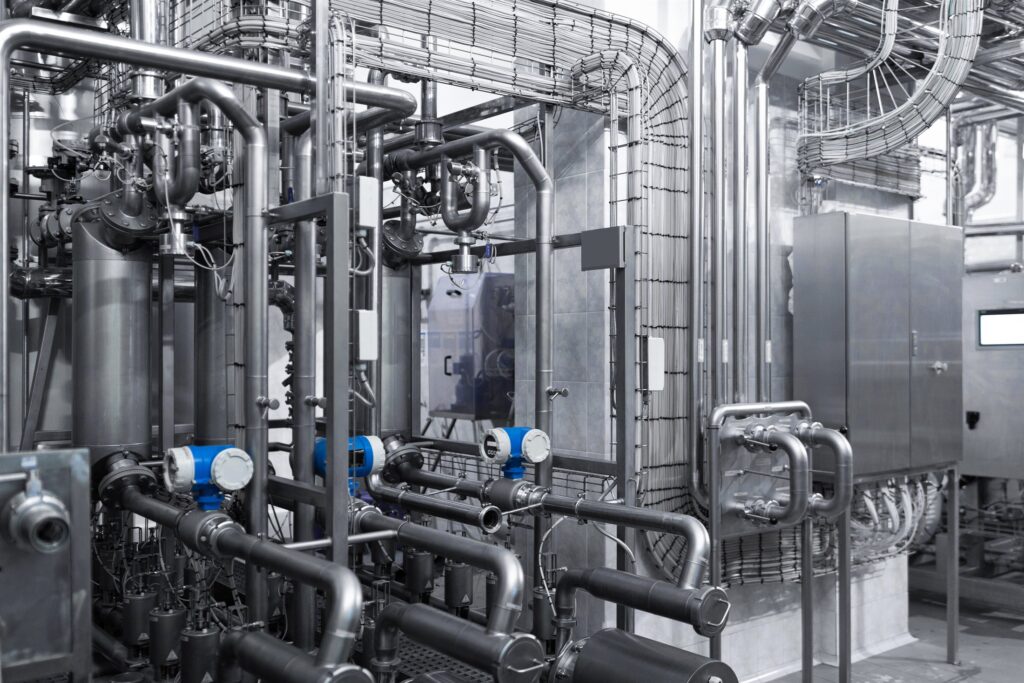 Complex process plant equipment, motors and pipework in an industrial facility
