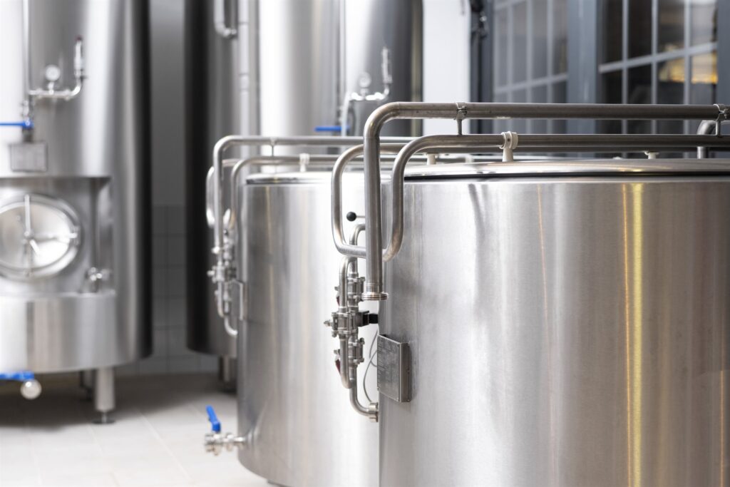 A clean, efficient process facility with stainless tanks and pipework