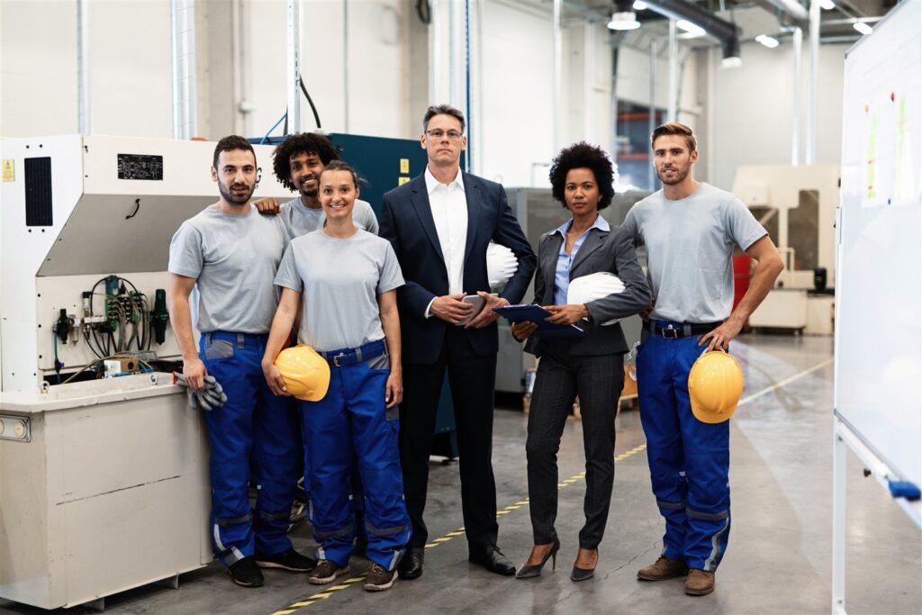 EM3 engineering team standing in an industrial facility