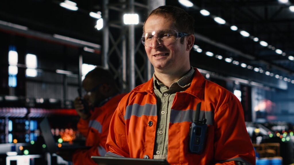 EM3 engineer with a tablet on an industrial site
