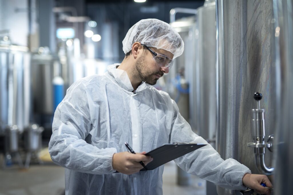EM3 engineer reviewing a process system in a pharmaceutical or chemical plant