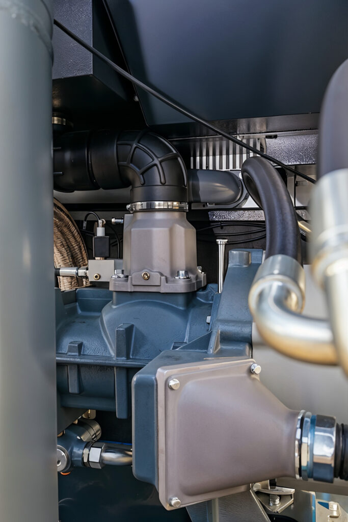 Internal pipes, valves and engine components of an industrial air compressor system