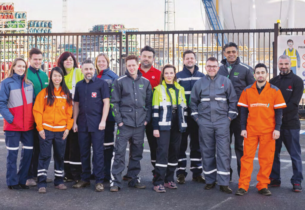 SHV Energy group colleagues in the branded workwear of the group operating companies, including Calor and SuperGasbras, at an energy terminal