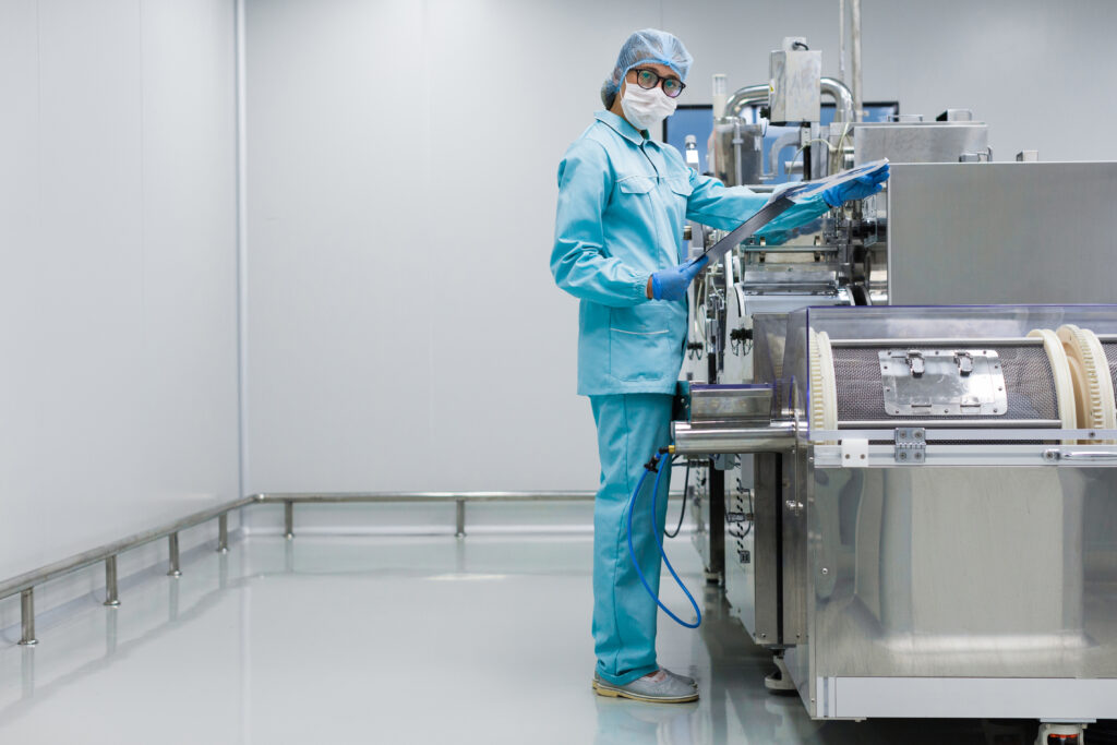 Rows of stainless steel process vessels in a sterile pharmaceutical production area